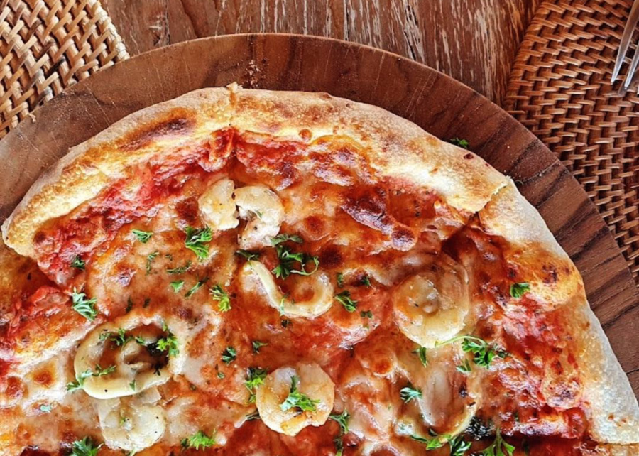 seafood pizza with classic Italian thin crust and sauce at Francesco's Pizza - restaurant in Gili Trawangan, Lombok, Indonesia