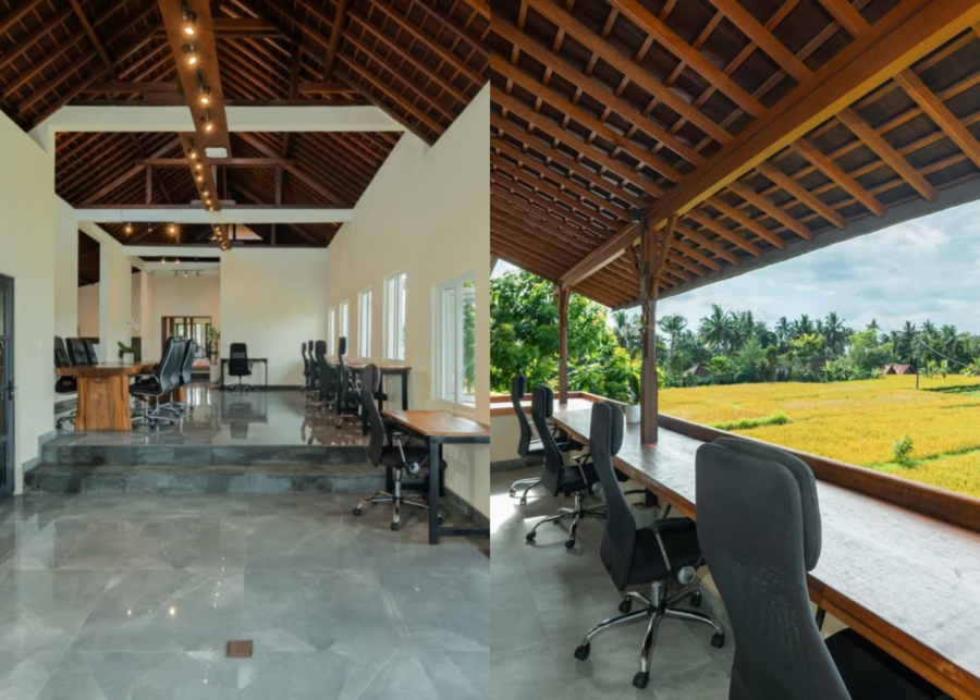 Interior of Ubud Coworking in Andong, with ergonomic chairs, timber desks and an open-air balcony overlooking green rice fields.