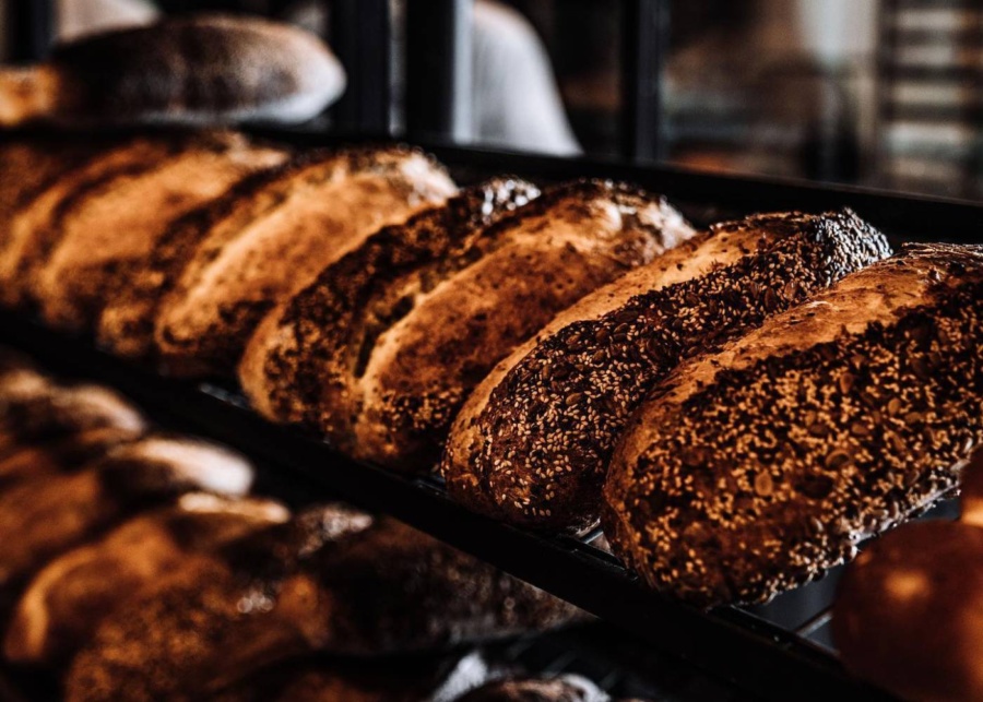 Loaves of multi-grain sourdough bread on display at Farine bakery in Canggu, Bali, Indonesia