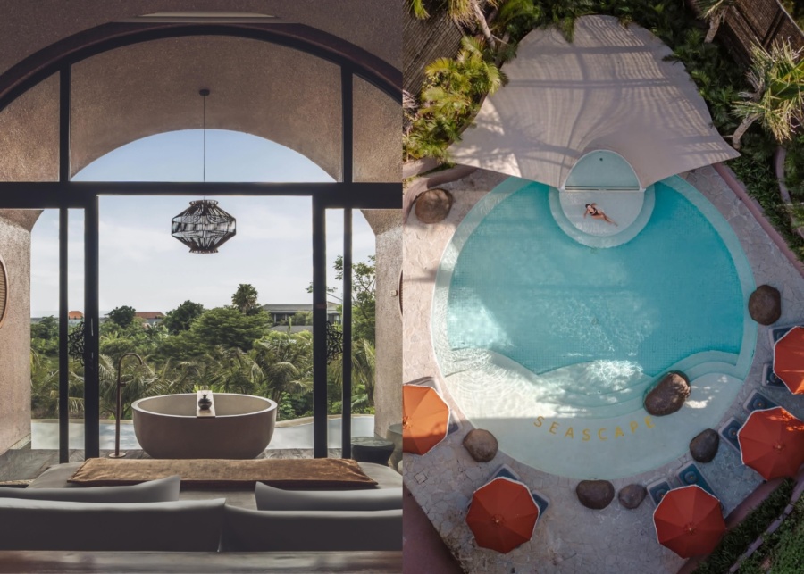 Bed overlooking outdoor bath tub and treetops, and the main swimming pool at Seascape Resort Sanur in Bali, Indonesia