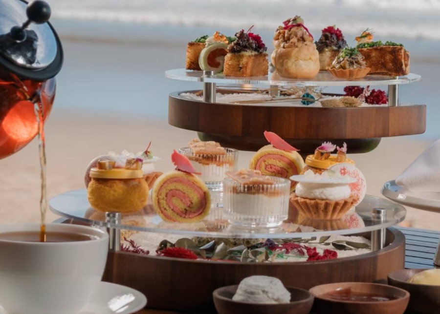 Swiss rolls, choux pastry, Croquembouche, sweets and savoury bites for beachfront afternoon tea at Starfish Bloo restaurant inside W Bali Seminyak