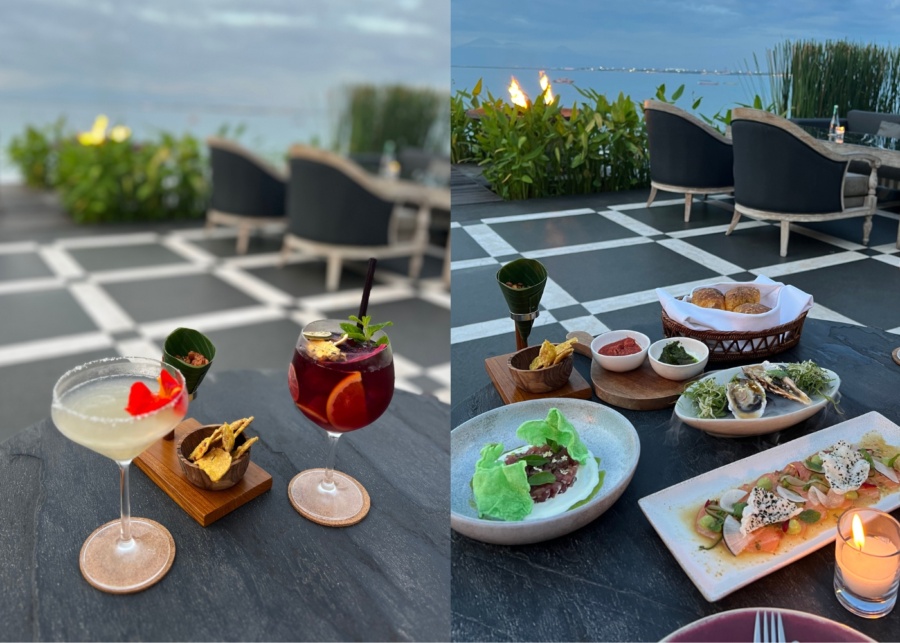 Cocktails and appetizers overlooking the ocean at Sundara, a hotel restaurant inside Four Seasons Resort Bali at Jimbaran Bay, Indonesia