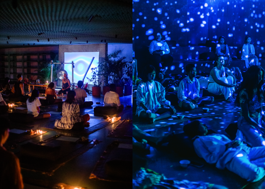 Guests participating in a guided meditation and sound healing session at Desa Potato Head Bali, with ambient lighting and immersive visuals creating a calming wellness atmosphere.