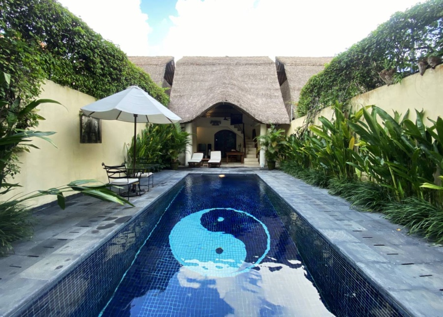Pool and garden at the one-bedroom villa at Impiana in Seminyak, Bali, Indonesia