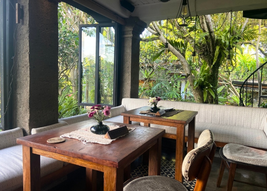 Seats near open windows overlooking trees and greenery at Zest cafe in Ubud, Bali, Indonesia - best for vegan breakfast and lunch