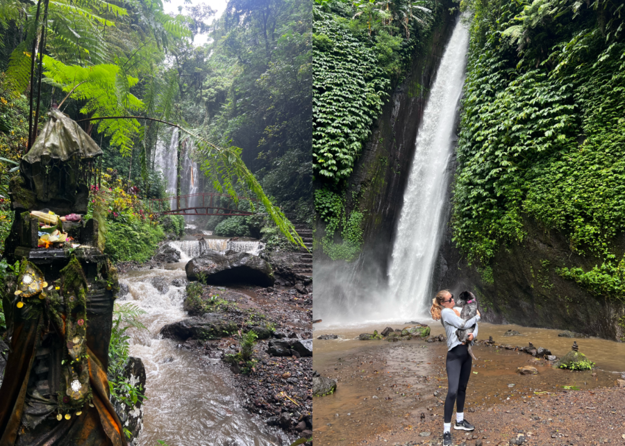 Lush jungle path leading to Munduk Waterfalls with a small red bridge over a stream, and a tall waterfall cascading down a mossy cliff with a person standing nearby.