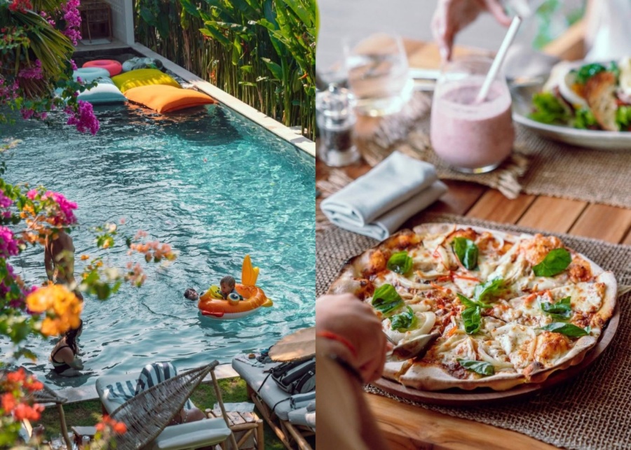 Family swimming and eating pizza at Banana Lounge pool club in Uluwatu, Bali, Indonesia