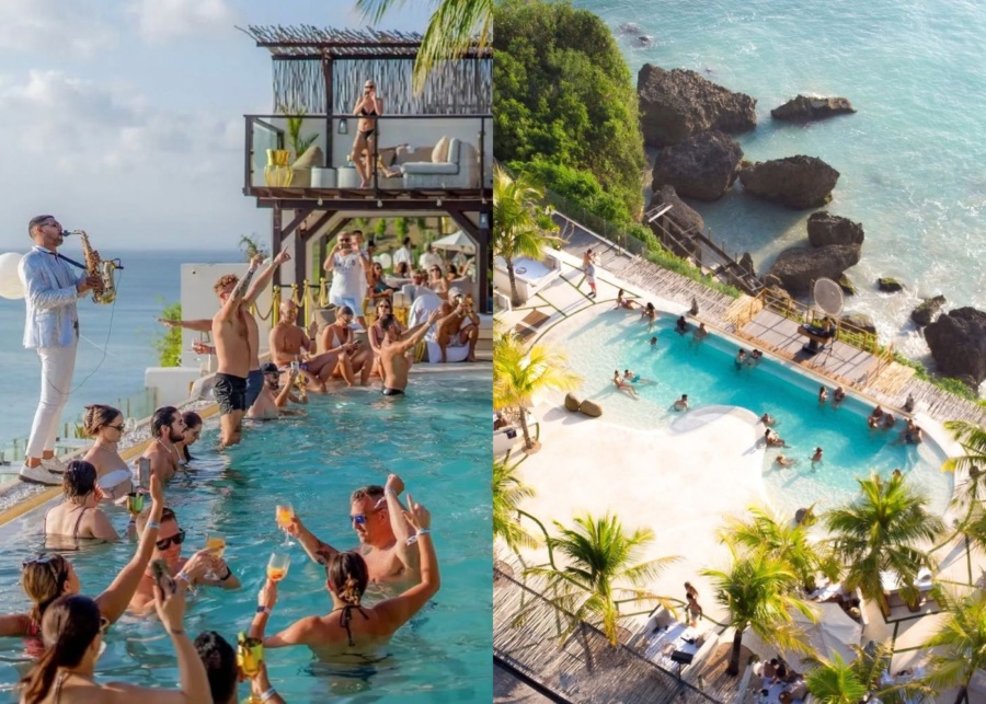 Sunset pool party and infinity pool overlooking the ocean at El Kabron day club in Uluwatu, Bali, Indonesia