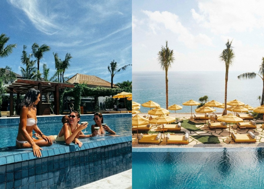 Guests drinking in the pool, and daybeds overlooking the ocean at Ulu Cliff House day club in Uluwatu, Bali, Indonesia