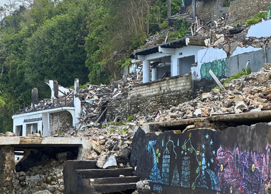 Aftermath of the Bingin Beach demolition in Uluwatu, Bali, showing collapsed structures and debris on the cliff