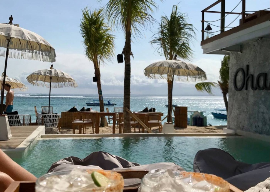 Infinity pool, cocktails and bean bag chairs at Ohana's Beach Club in Nusa Lembongan, Bali, Indonesia