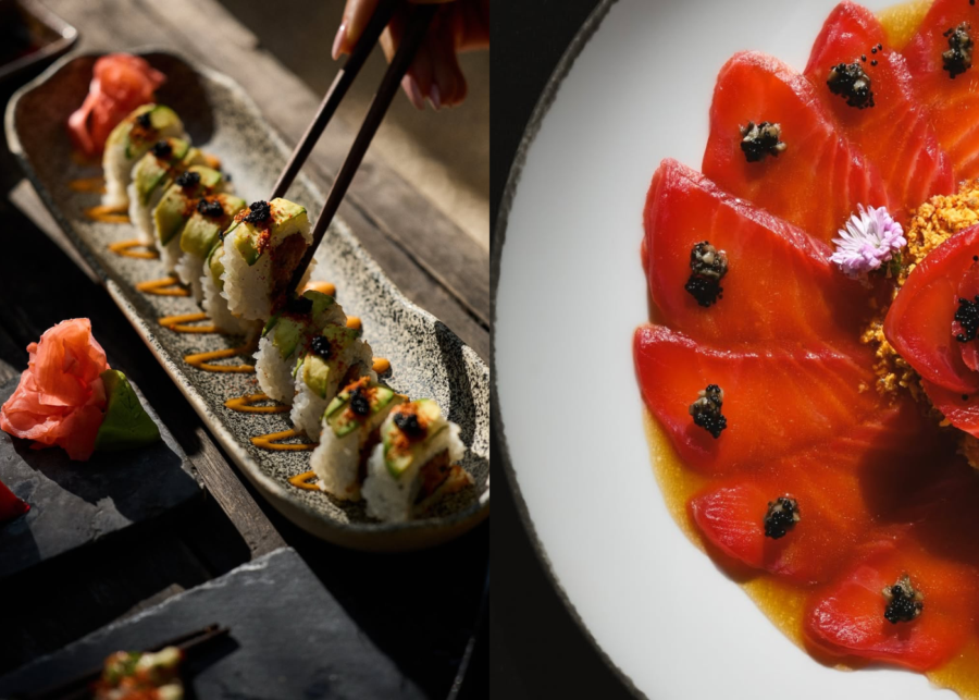 Chopsticks lifting an avocado-topped sushi roll with caviar at Ulu Fish Market, beside a plate of sliced raw fish fanned out with caviar and citrus dressing.