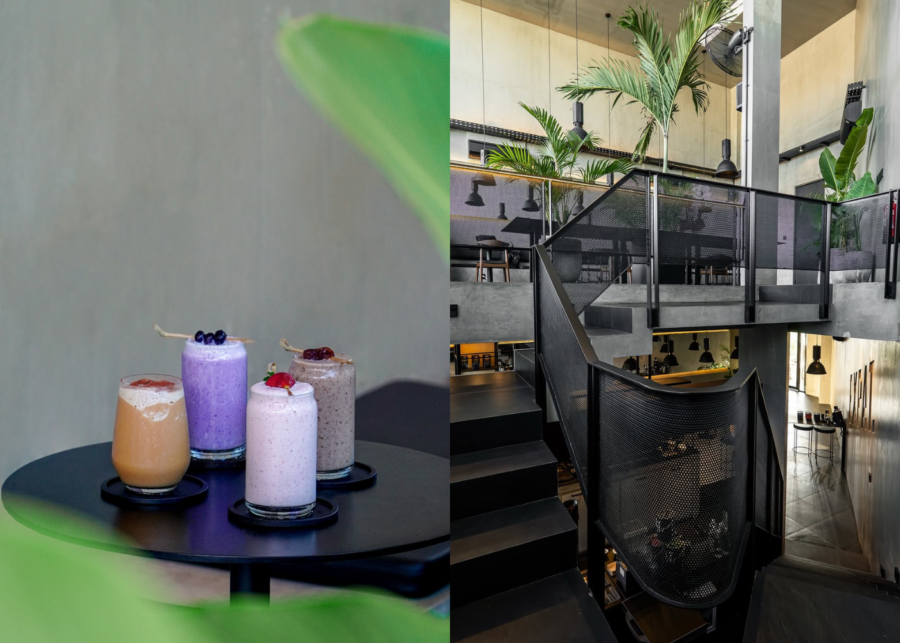 Four fruit smoothies lined up on a black table framed by green leaves at Expat. Roasters in Uluwatu.