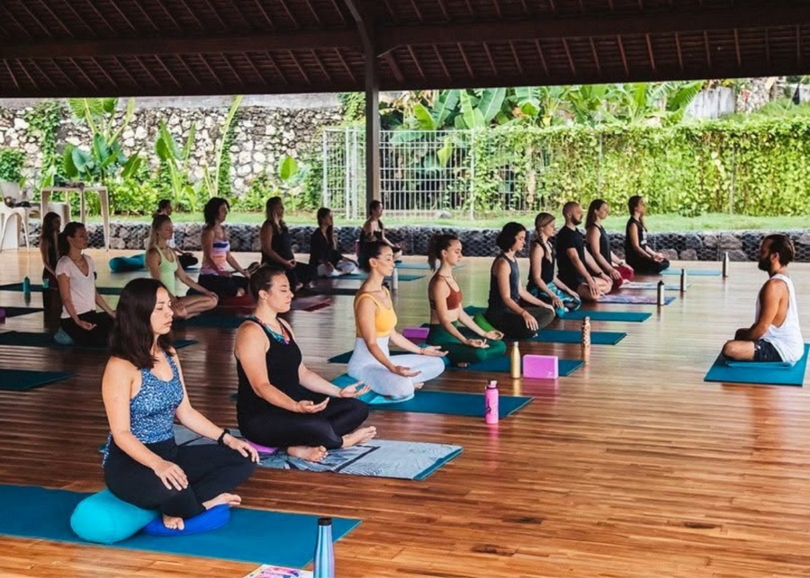 Meditation and breathwork as part of yoga teacher training at Samasti Bali in Kerobokan