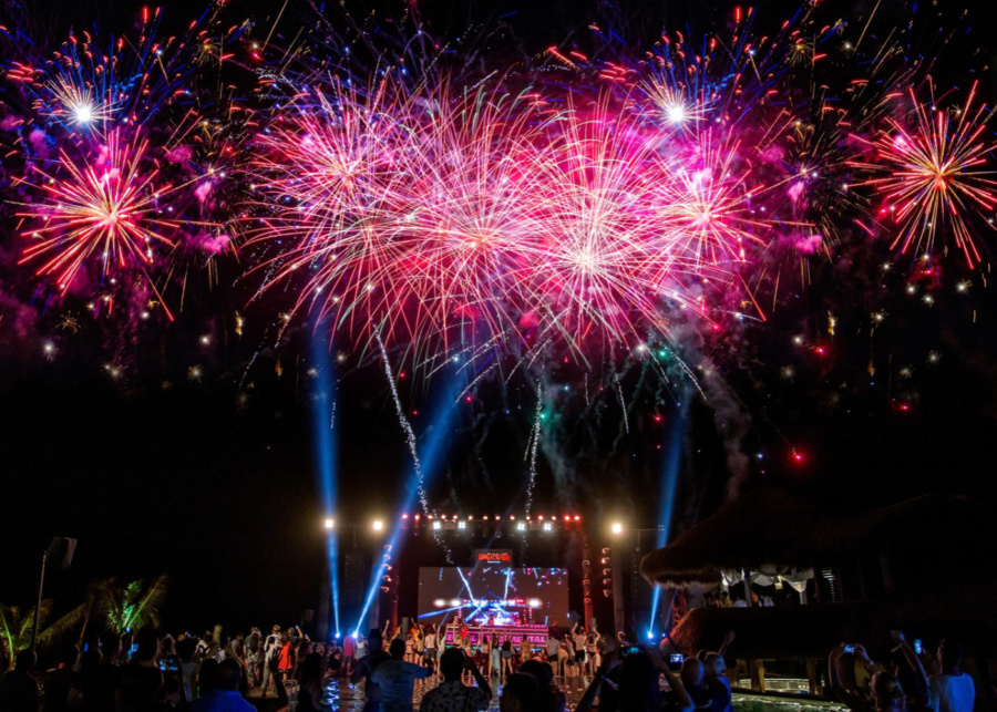 Fireworks over the main stage on New Year's Eve at Roosterfish Beach Club in Pandawa Bali Indonesia - NYE 2026