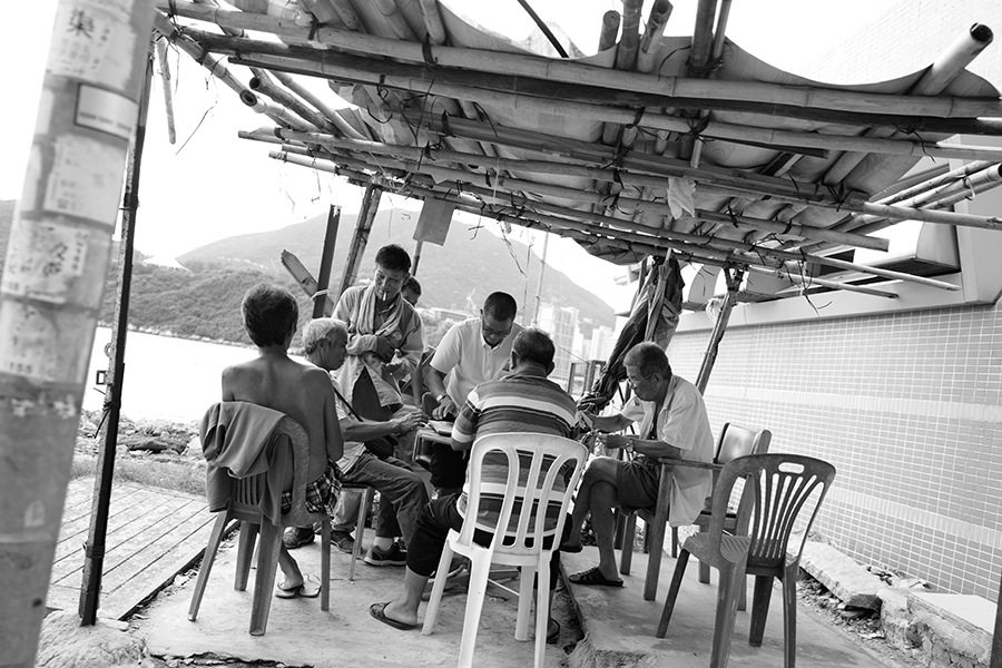 black and white photography Hong Kong pocket gamers in Lei Yue Mun Park