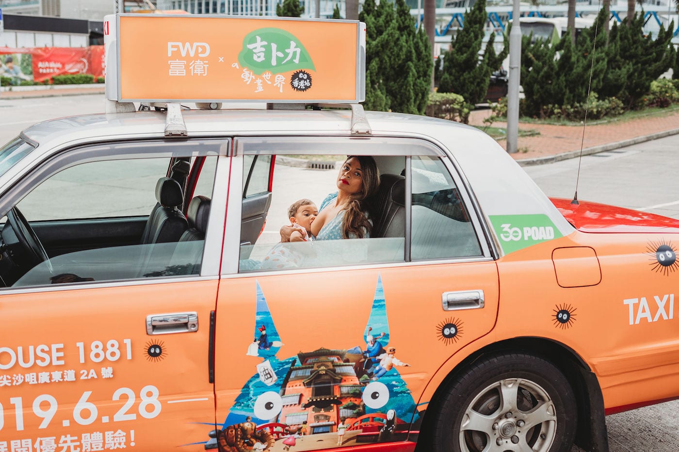 woman breastfeeding in taxi