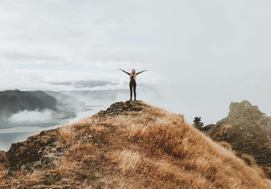 A person climbed to the summit of a mountain