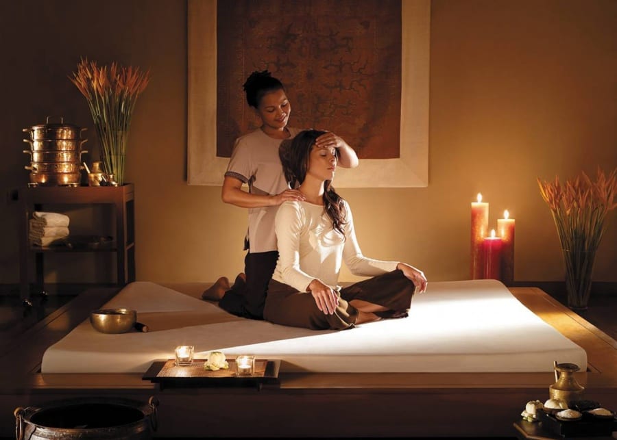 therapist treating a woman at shangri-la spa