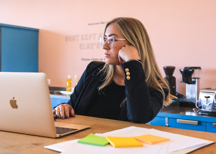 person staring at her laptop