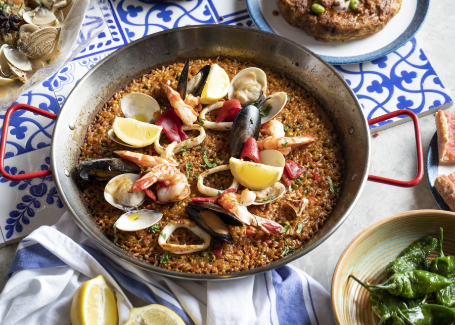 a big plate of paella with various seafoods