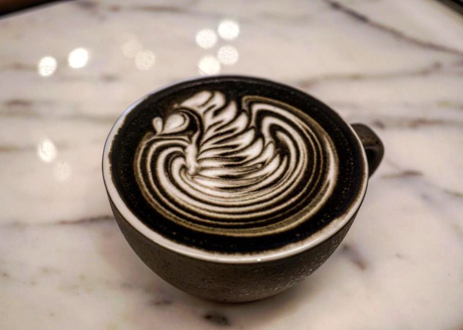 black charcoal latte art coffee