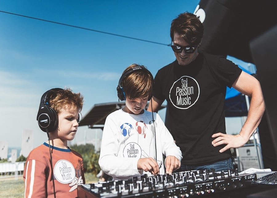 kids learning from a DJ