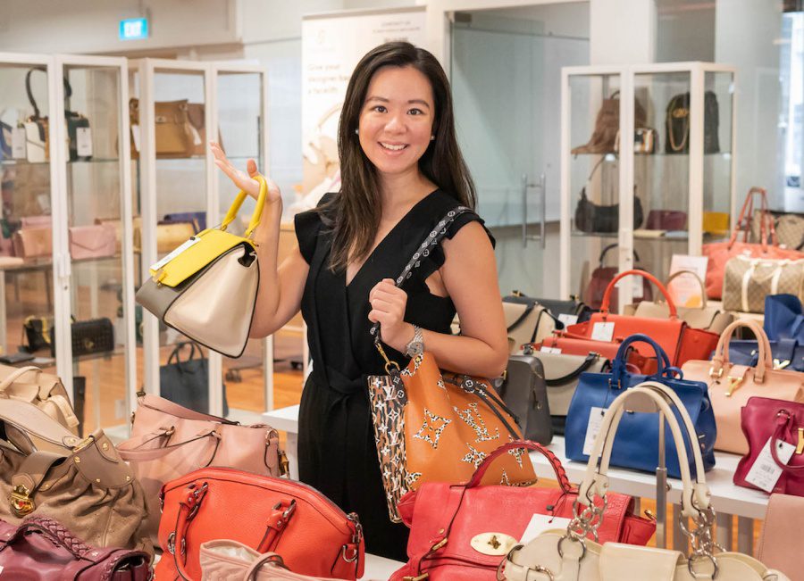 Jennifer Ong holding designer bags