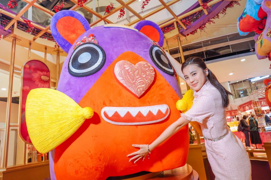 lady hugging an installation of a cloth tiger