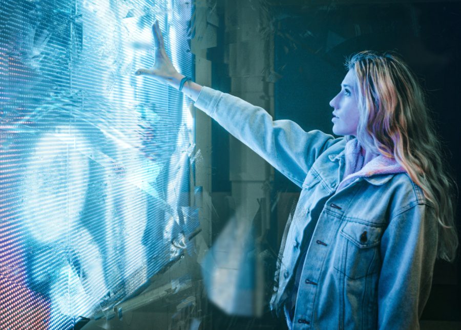 woman in front of wall digital virtual reality