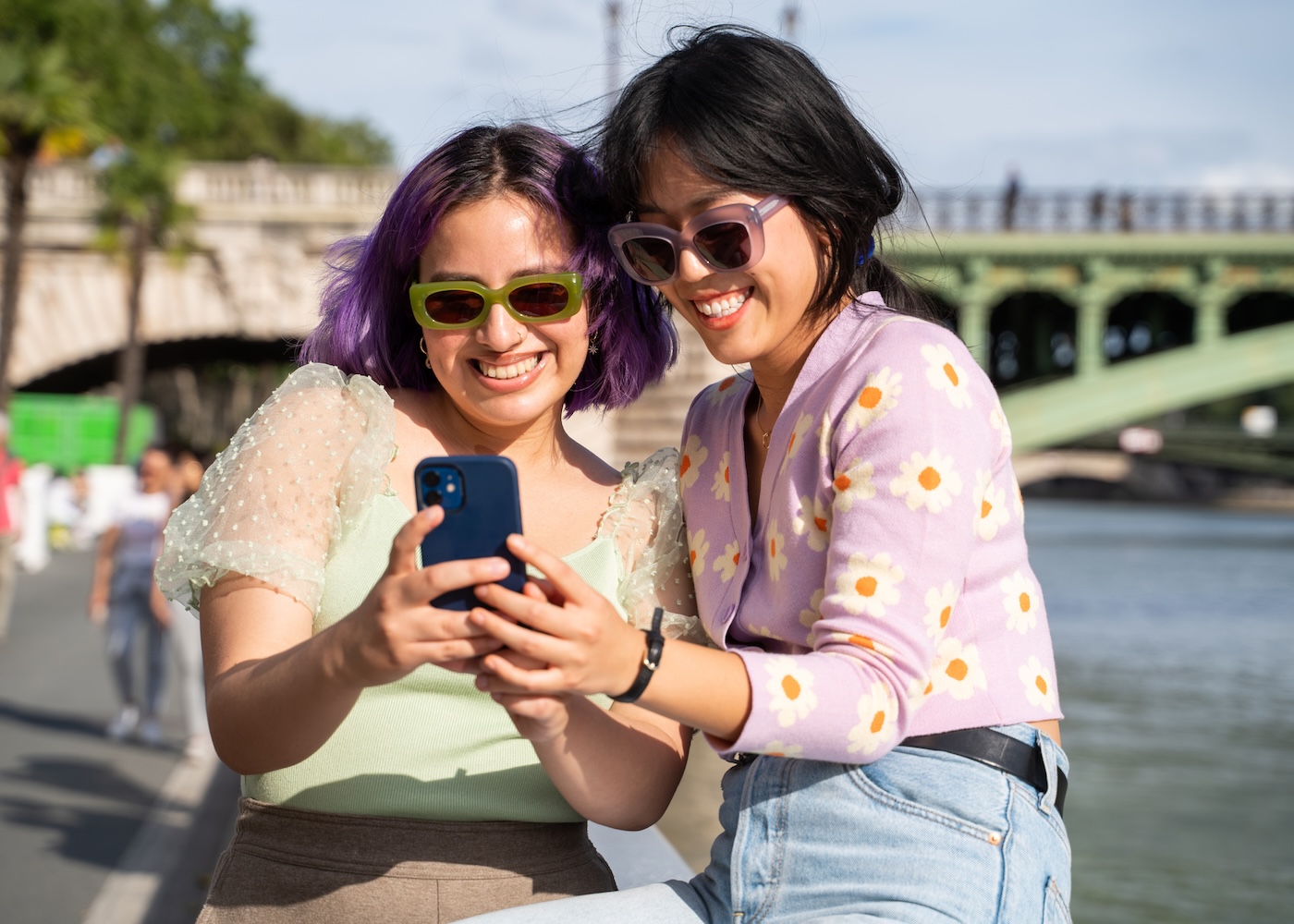 travelling friends happily using phone