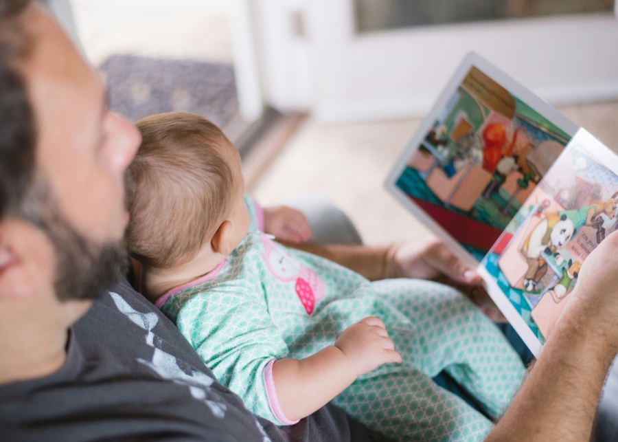 Withers fathers custody rights - A man reading a book to his baby